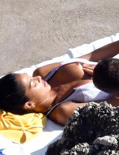 Nicole Scherzinger nude boob on a beach