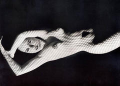 Lysette Anthony lying nude black-&-white photo