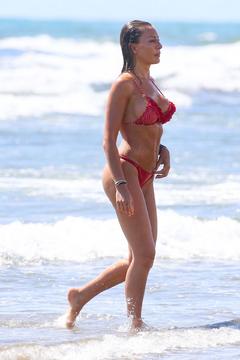 Alessia Tedeschi sexy in red bikini on a beach in Italy