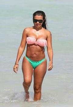 Vida Guerra sexy in bikini on a beach