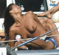 Megan Gale topless on a boat paparazzi photo