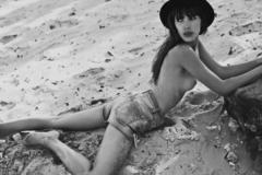 Coralie Joos topless at denim shorts on a beach