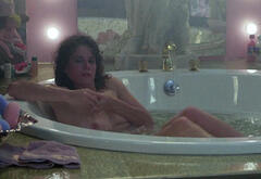 Nancy Travis nude in a bathtub at Married to the Mob