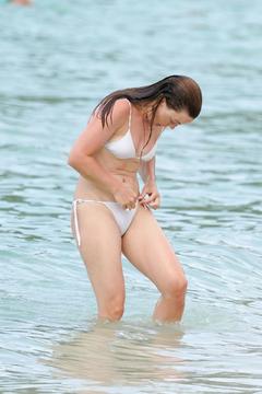Melissa George in white bikini on the beach in St. Barts