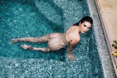 Kendall Jenner naked in a pool