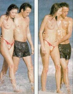 Carla Bruni topless on a beach