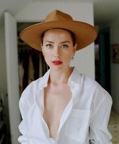 Amber Heard braless under white blouse