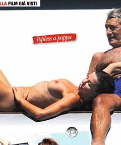 Italian actress Alba Parietti sunbathing topless on a yacht paparazzi photo