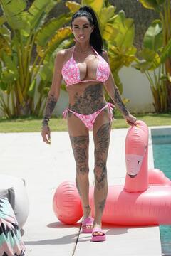 Katie Price in a pink bikini poolside - June 2025