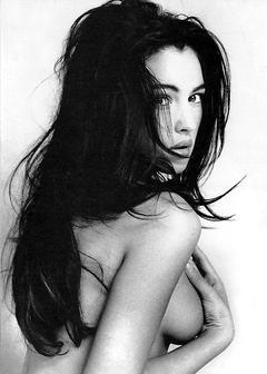 Young Monica Bellucci topless cover her tits