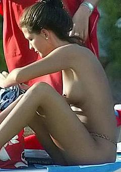 Alessia Merz topless on a beach