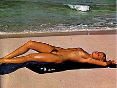 Adrienne Mandie sunbathing fully nude shows her tits and hairy pussy