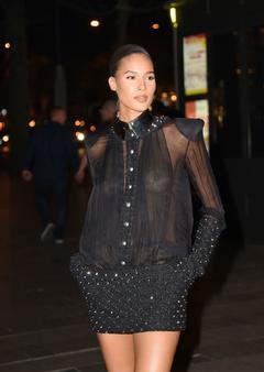 Cindy Bruna braless in see through blouse attends the dinner at the Fouquets Restaurant for the Opening of the Fashion Week in Paris