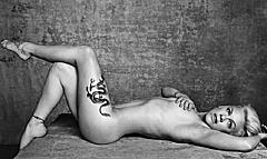 Singer Pink naked but covered