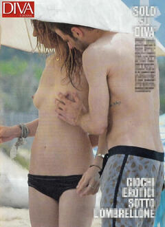 Myriam Catania topless on a beach paparazzi photo