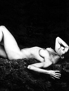 Actress Demi Moore lying naked