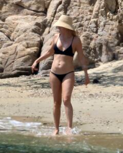 Kate Hudson in black bikini on a beach - June 2025