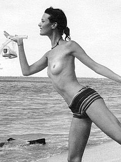Shalom Harlow topless on a beach scan
