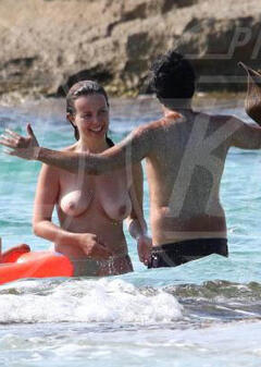 Violante Placido topless in a water paparazzi photo