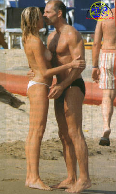 Silvia Rocca topless on a beach with honey paparazzi image