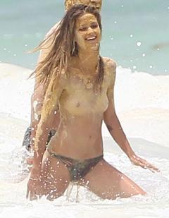 Niamh Adkins topless in a water