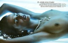 Carmen Kass lying topless