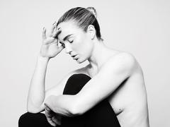 Caity Lotz braless black-&-white image