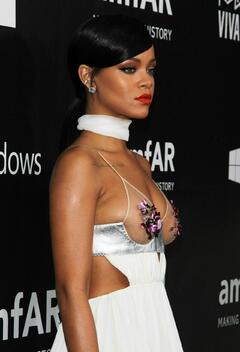 Rihanna in see through dress at- amfAR LA Inspiration Gala in Hollywood
